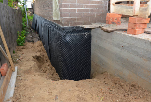 SJ Waterproofing Pros technician performing targeted Waterproofing assessment in Suring, WI
